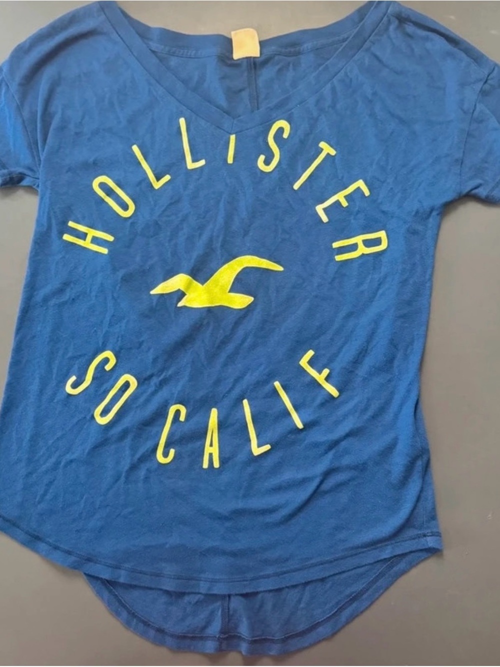 Hollister womens. Blue V-Neck Graphic Tee with Yellow Logo